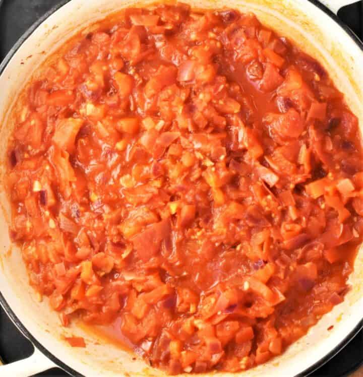 Tomato sauce in large shallow pan.