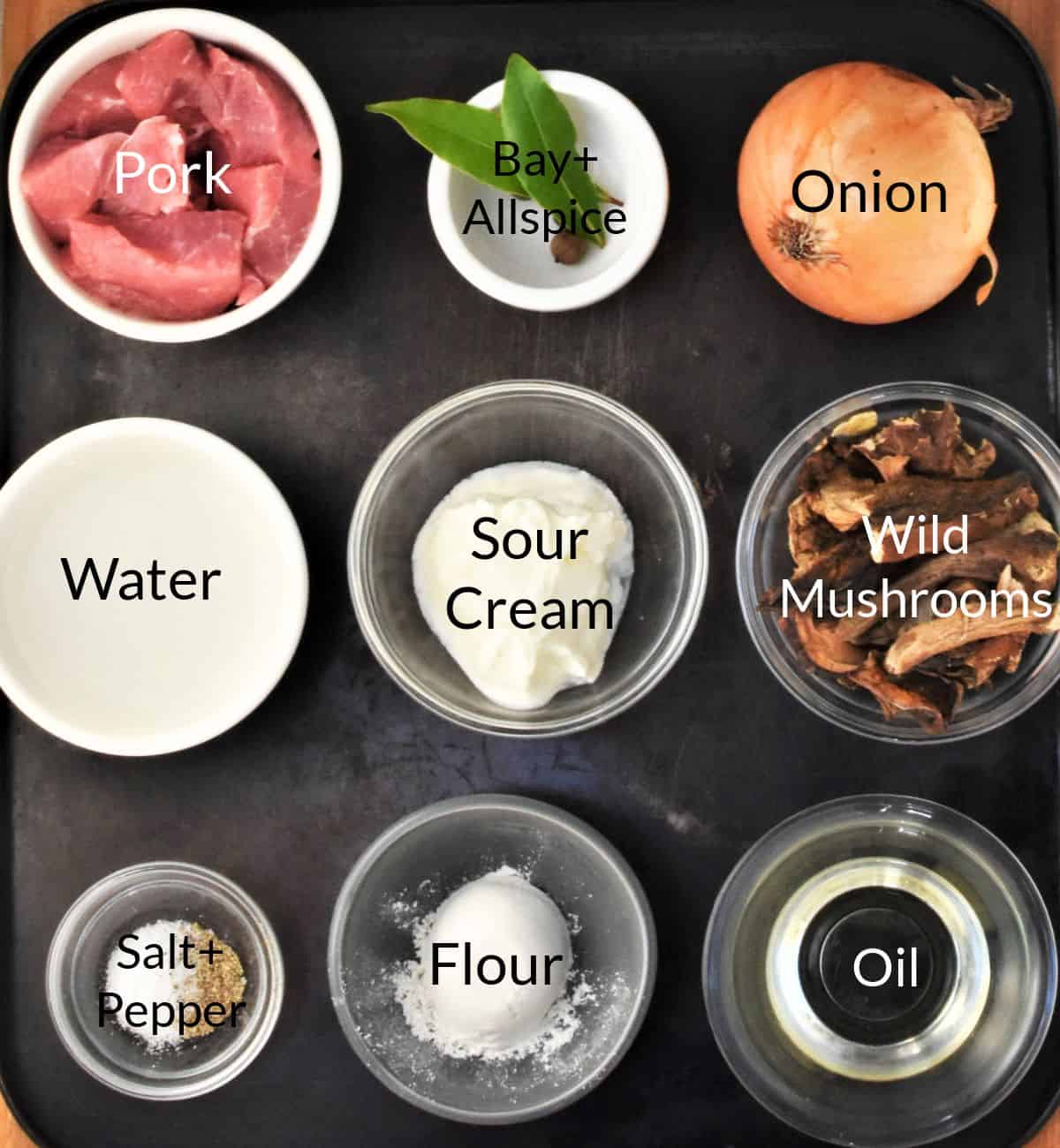 Ingredients for making pork goulash in individual dishes.