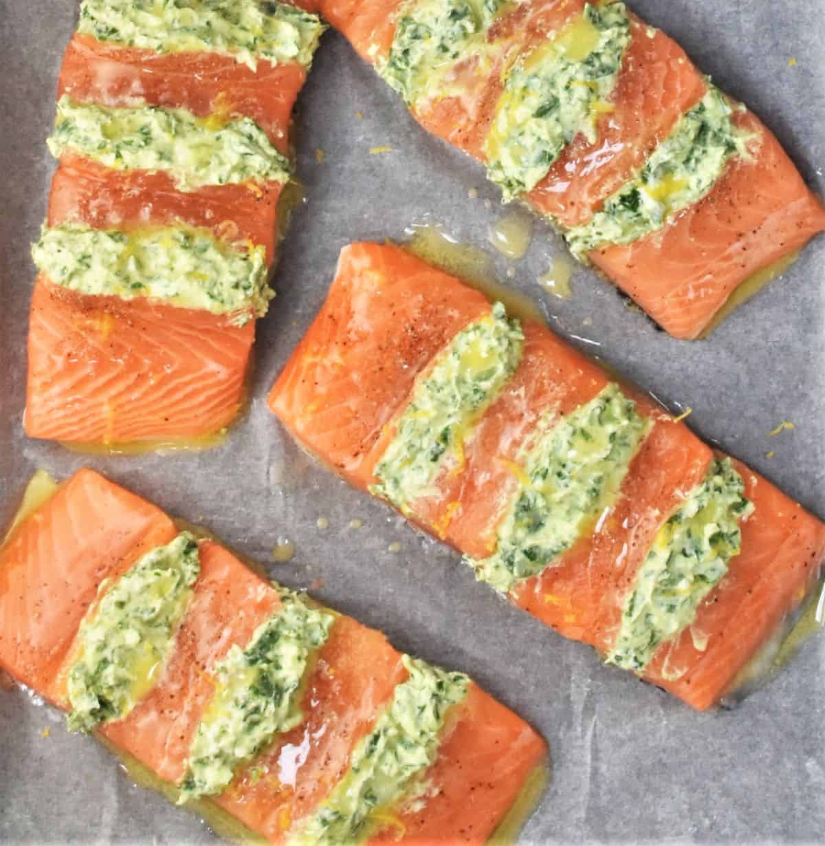 Top down view of raw salmon fillets with filling.