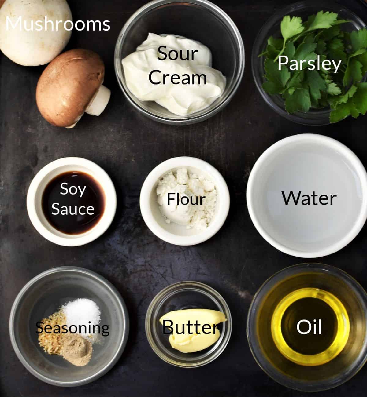 Ingredients for making sour cream mushroom sauce in individual dishes.