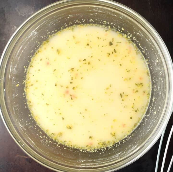 Top down view of sour cream sauce base in bowl.