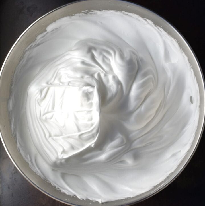 Thick egg white mixture in bowl.