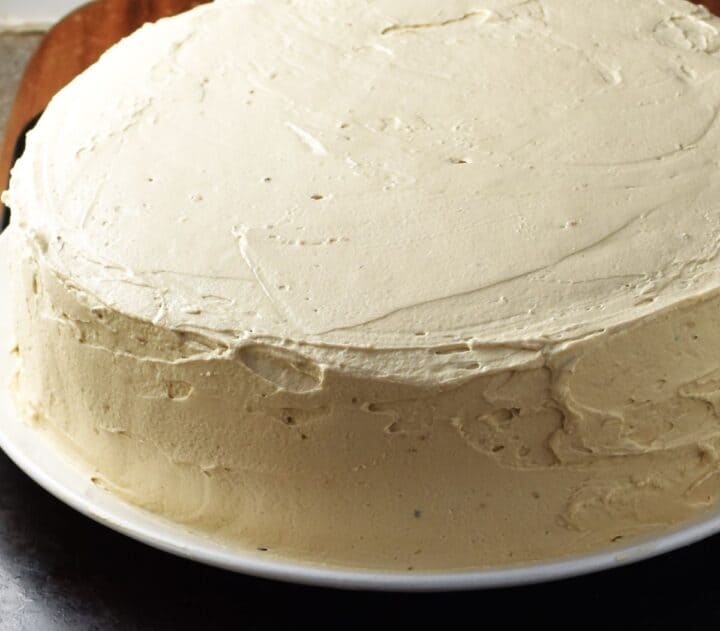 Side view of frosted walnut torte.