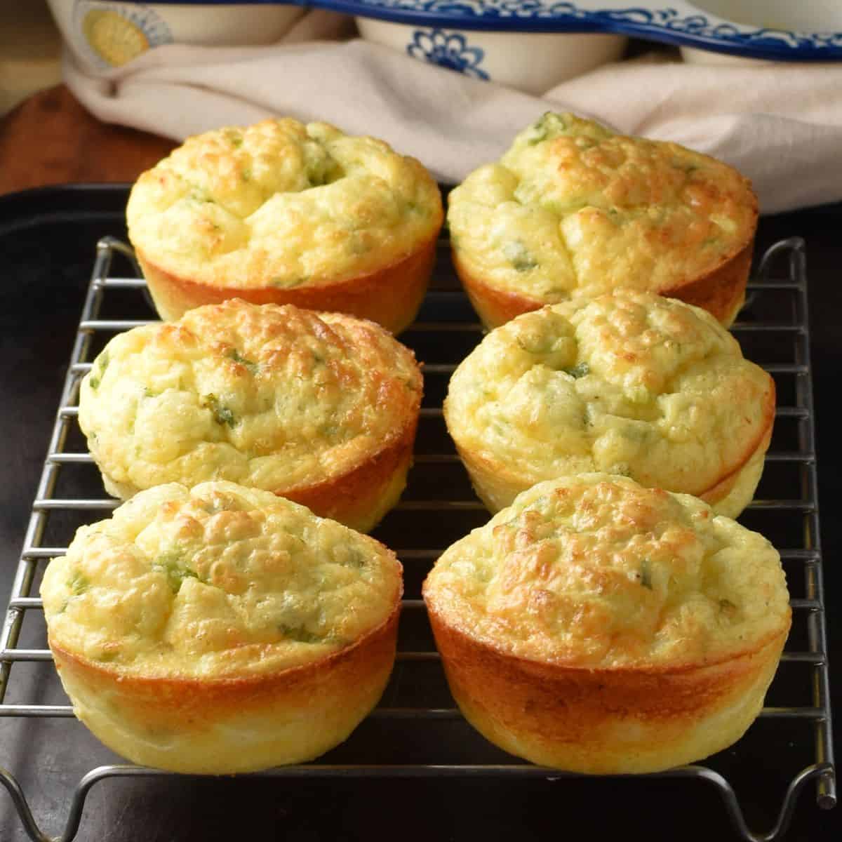 Side view of 6 cottage cheese egg muffins on rack.