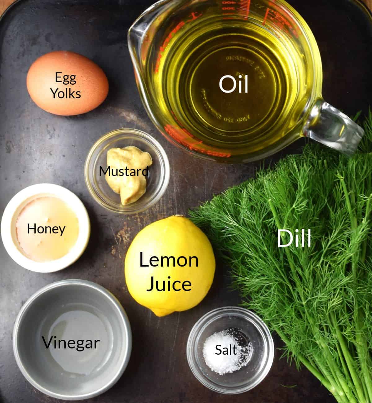 Ingredients for making dill mayonnaise in individual dishes.