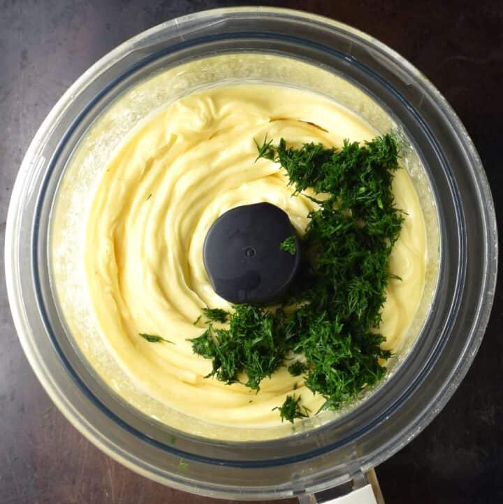 Mayonnaise with fresh dill in food processor.