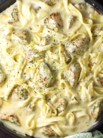 Top down view of sour cream chicken pasta in round pan.