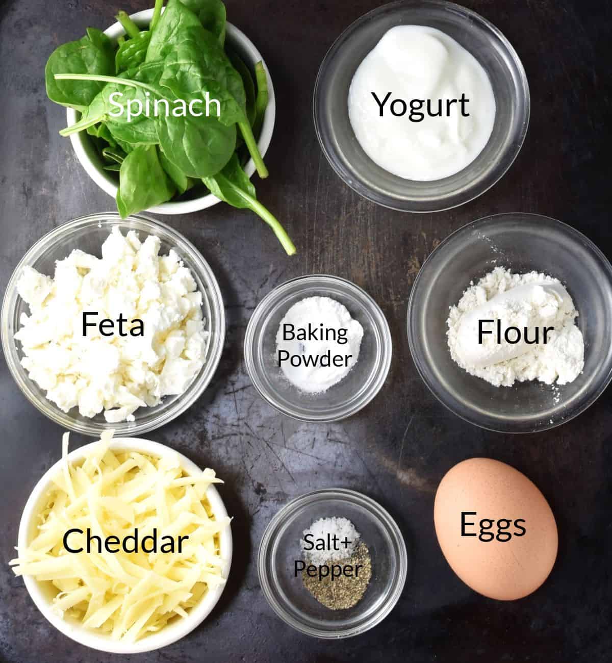Ingredients for making egg spinach muffins in individual dishes.