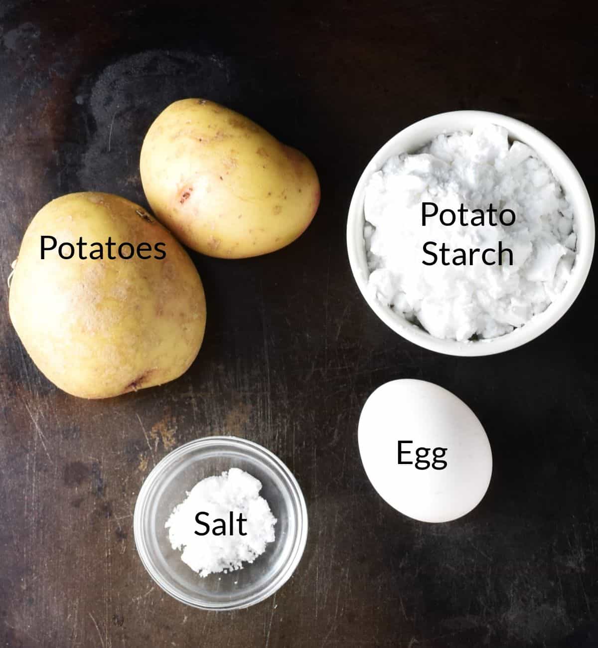 Ingredients for making silesian dumplings in individual dishes.