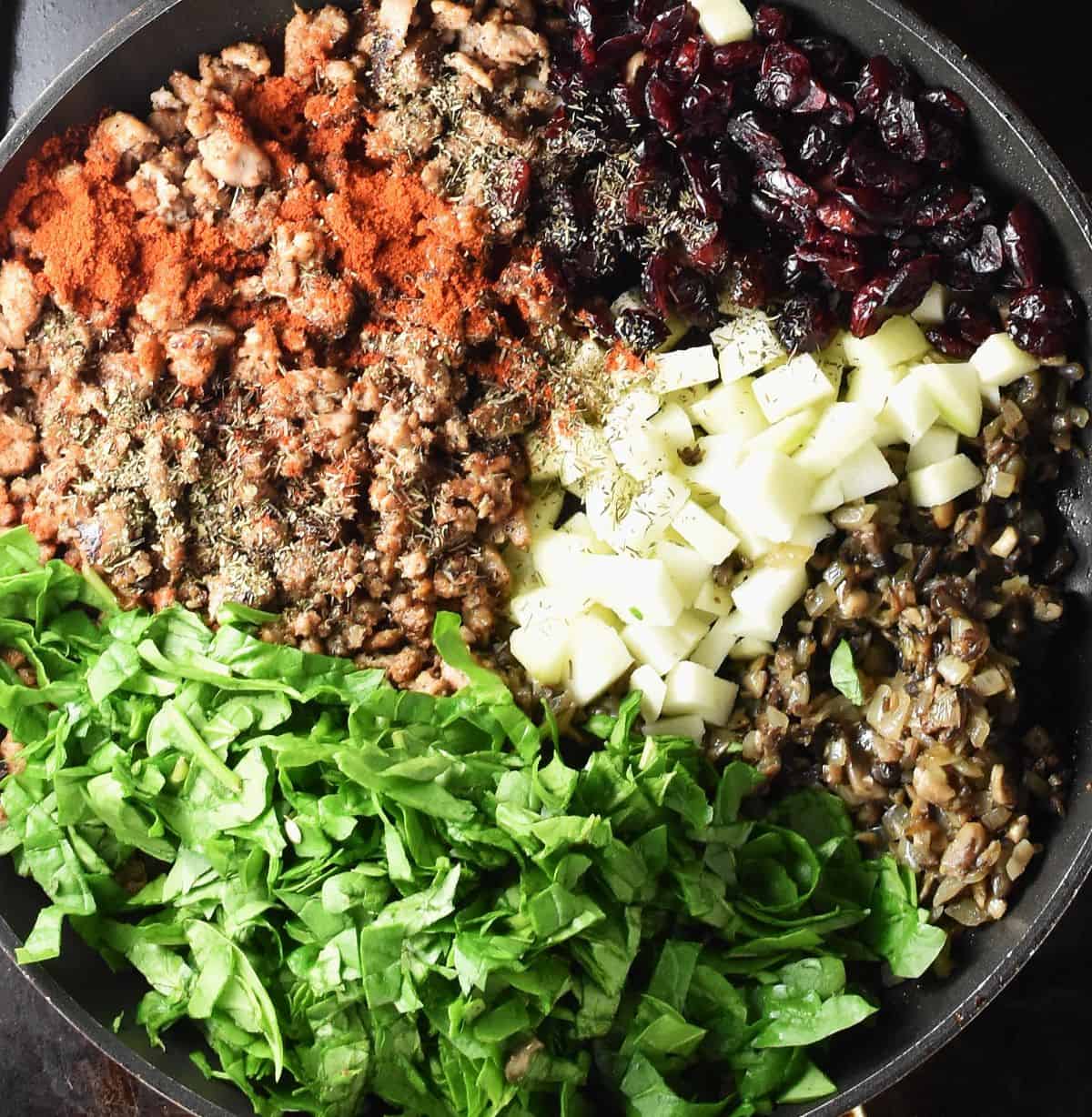 Ingredients for stuffing acorn squash assembled in large pan.