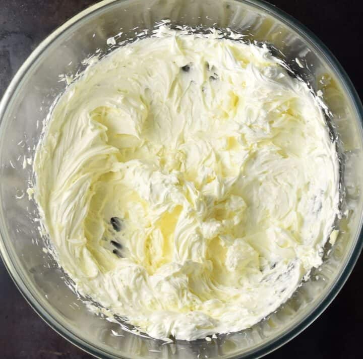 Pale butter mixture in glass bowl.