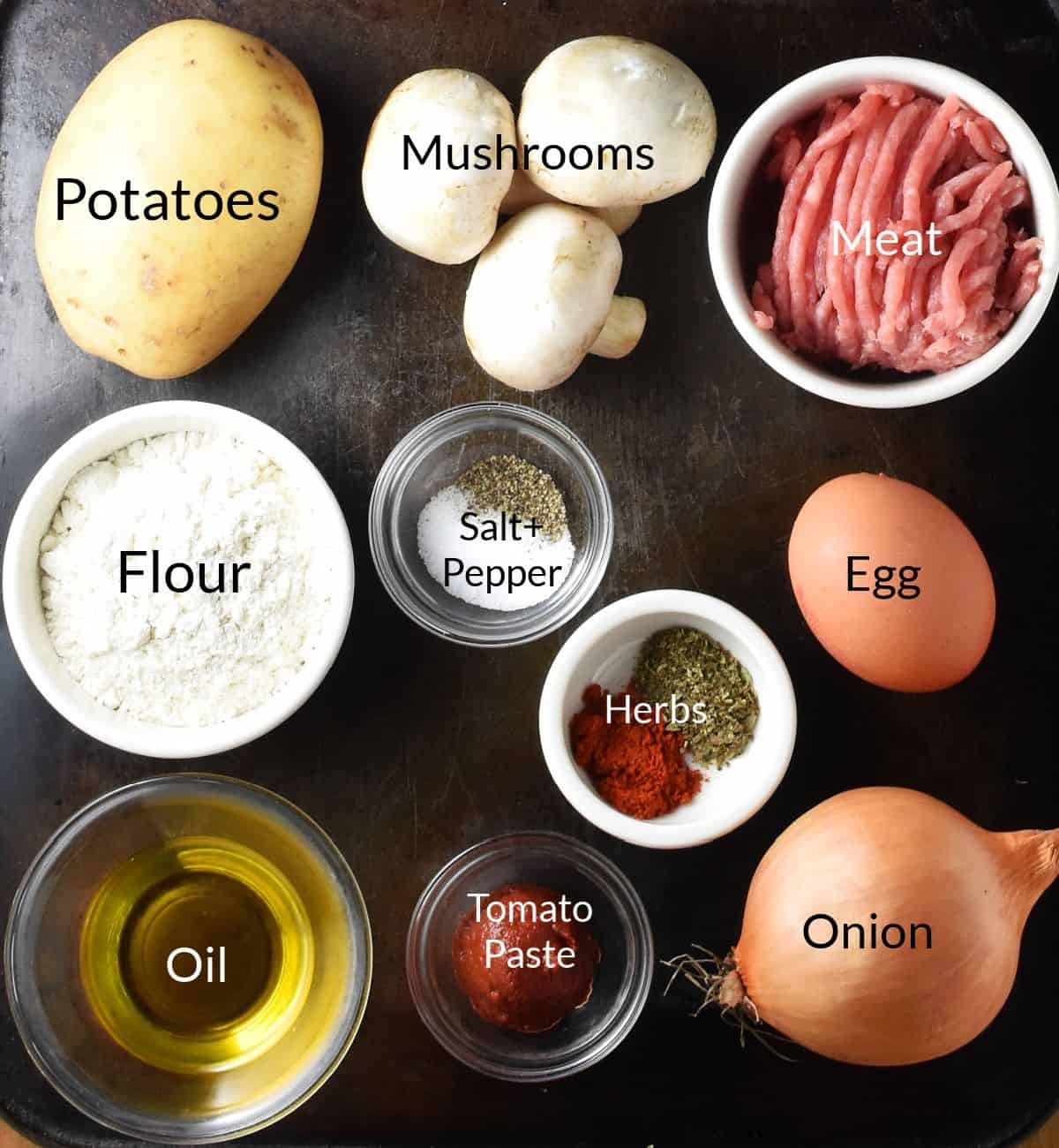 Ingredients for making stuffed potato cakes in individual dishes.