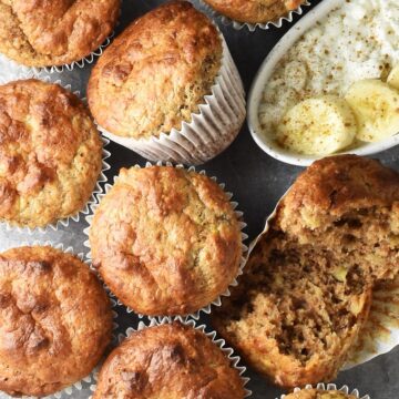 Top down view of cottage cheese banana muffins in paper cases close together.