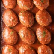 Top down view of Polish unstuffed cabbage rolls in tomato sauce with dill.