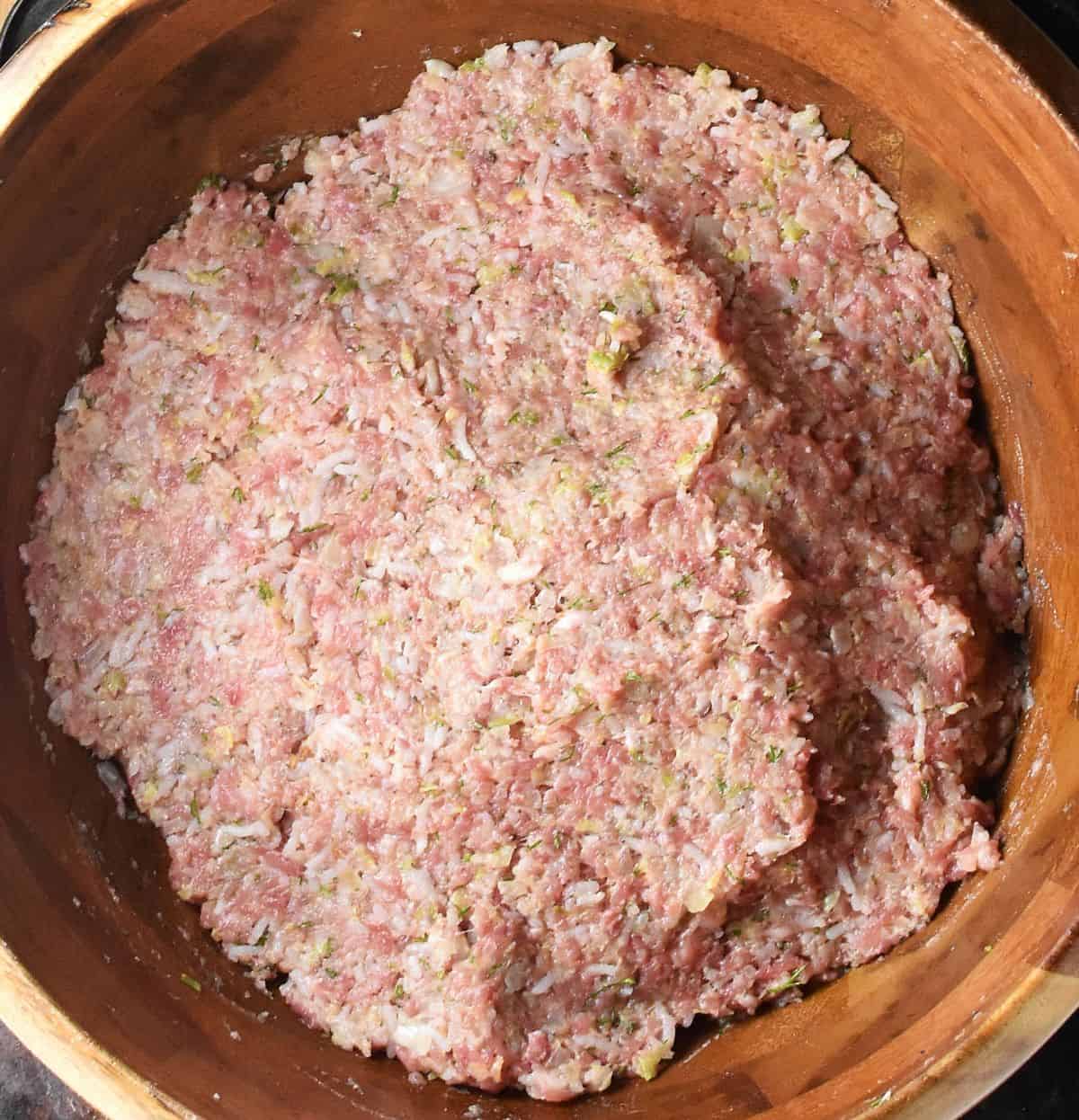 Lazy cabbage roll mixture in large brown bowl.