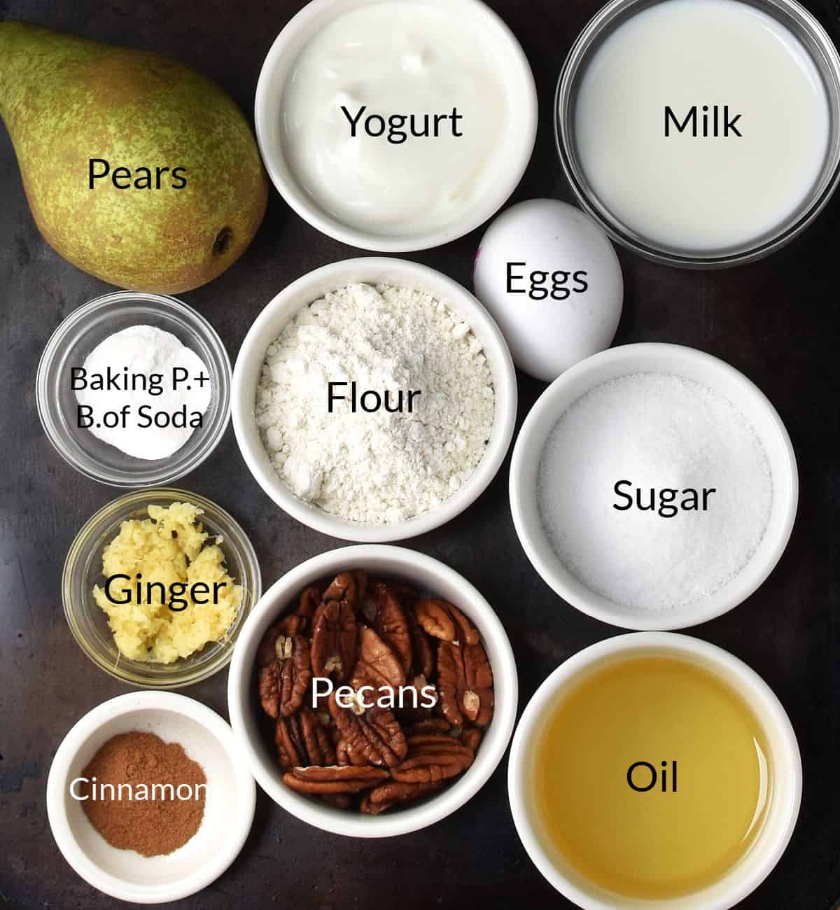 Top down view of pear muffins ingredients in individual dishes.