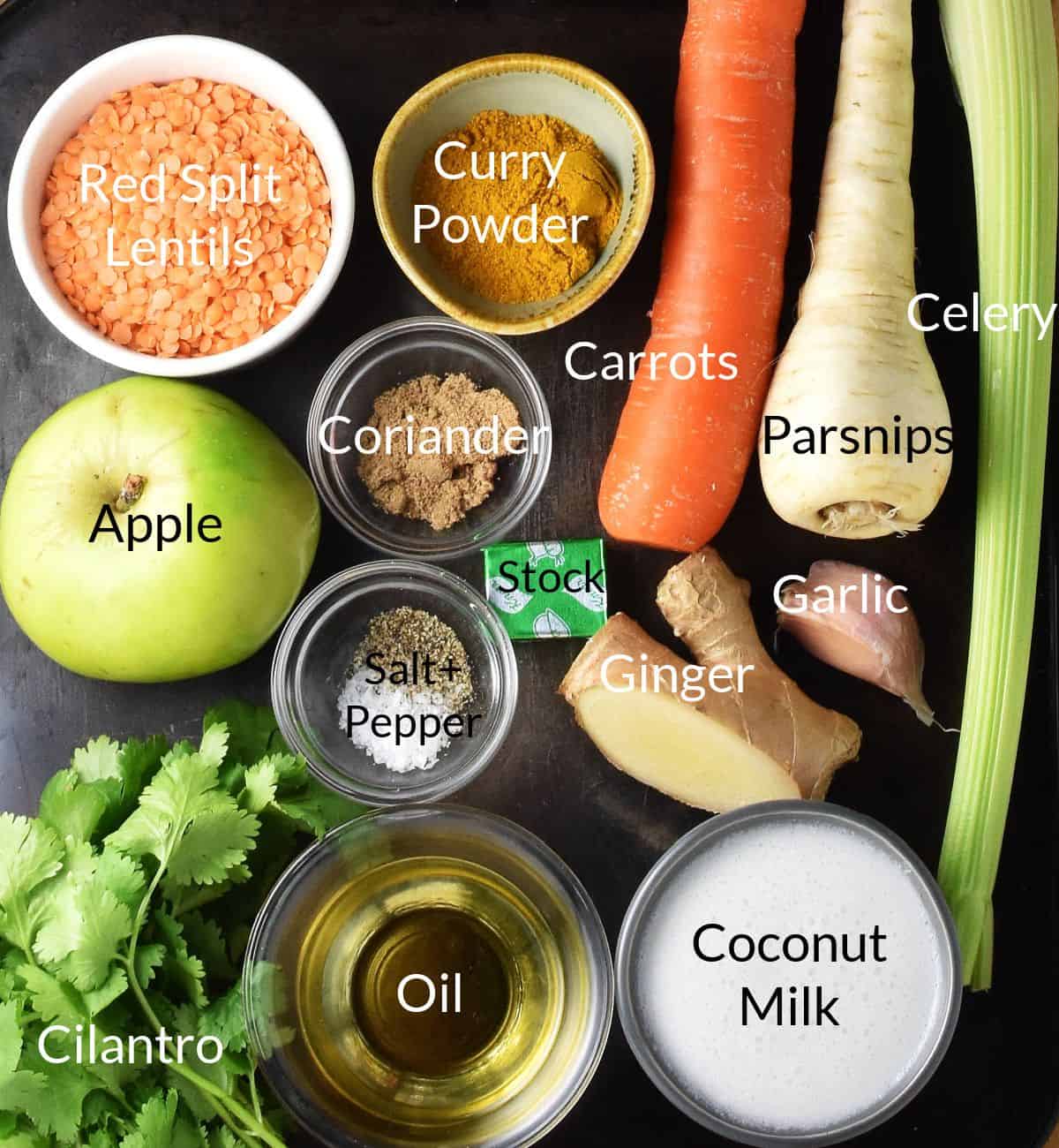 Top down view of ingredients for vegetable mulligatawny soup in individual dishes.