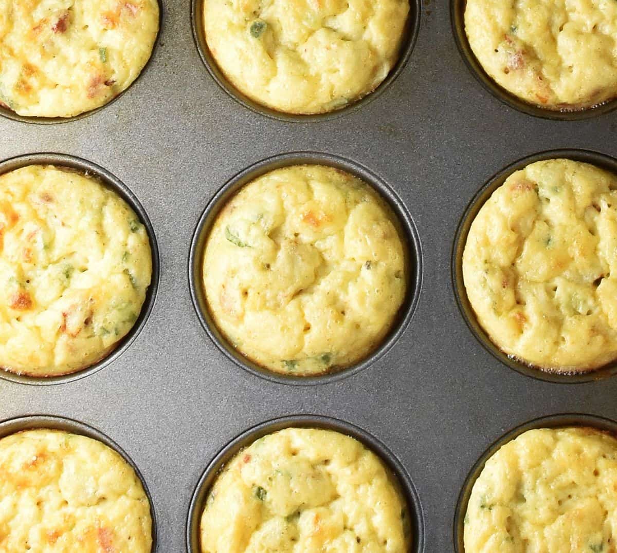 Top down view of baked egg potato muffins in pan.